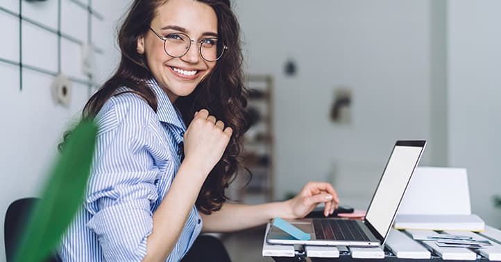 smiling lady at a laptop